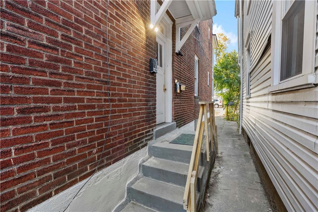 1210 Holmes Street McKees Rocks, PA 15136 - Photo 29 of 44 a view of a brick buildings with entryway