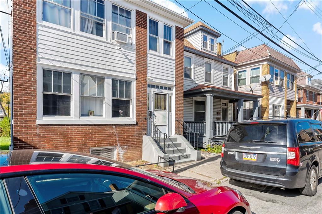 1210 Holmes Street McKees Rocks, PA 15136 - Photo 3 of 44 a front view of a building with multiple windows