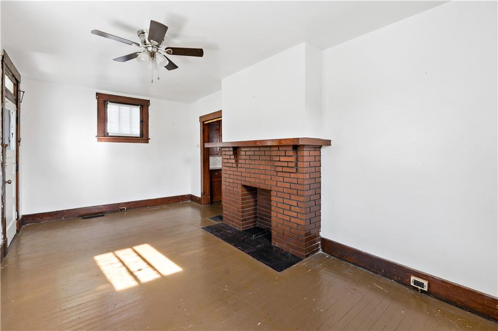 1210 Holmes Street McKees Rocks, PA 15136 - Photo 5 of 44 a view of empty room with windows
