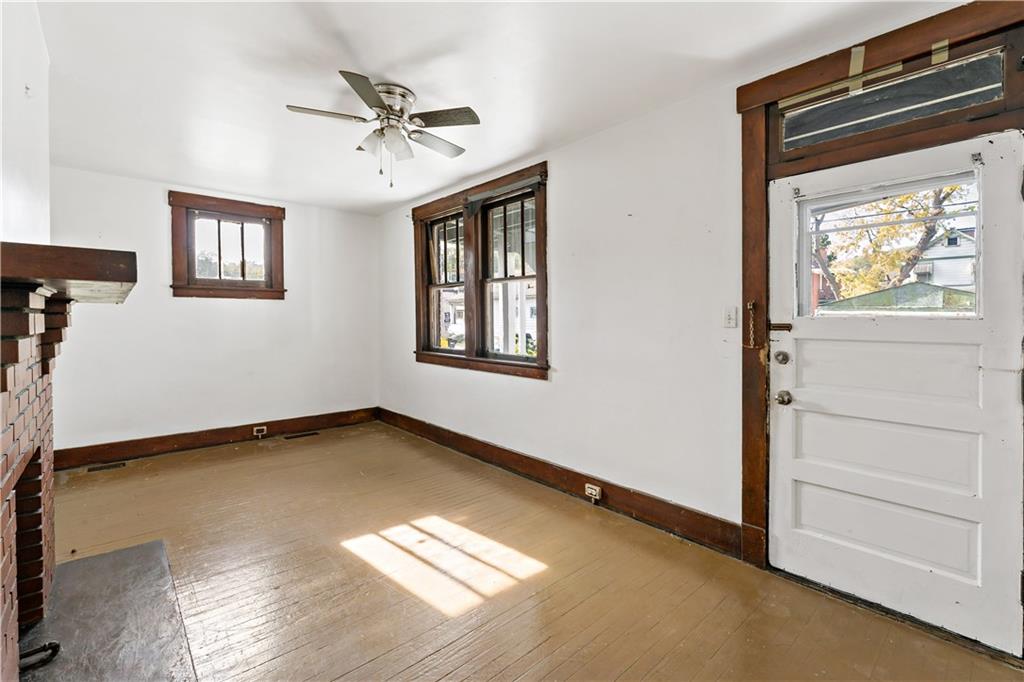 1210 Holmes Street McKees Rocks, PA 15136 - Photo 6 of 44 a view of an empty room with a window