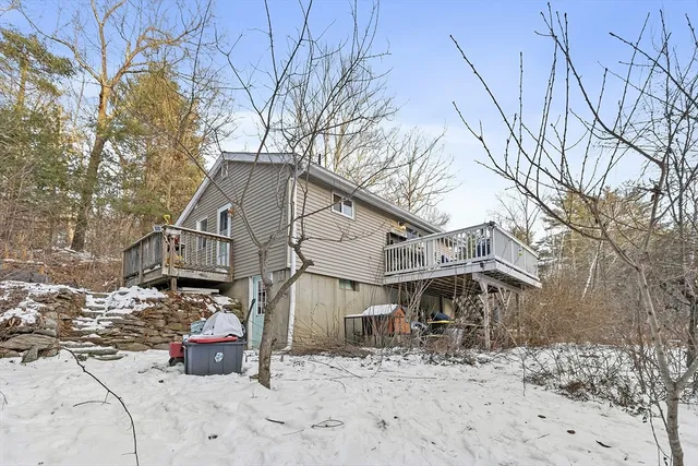 a view of a house with a snow in the yard