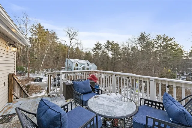 a view of a chairs and table on the deck