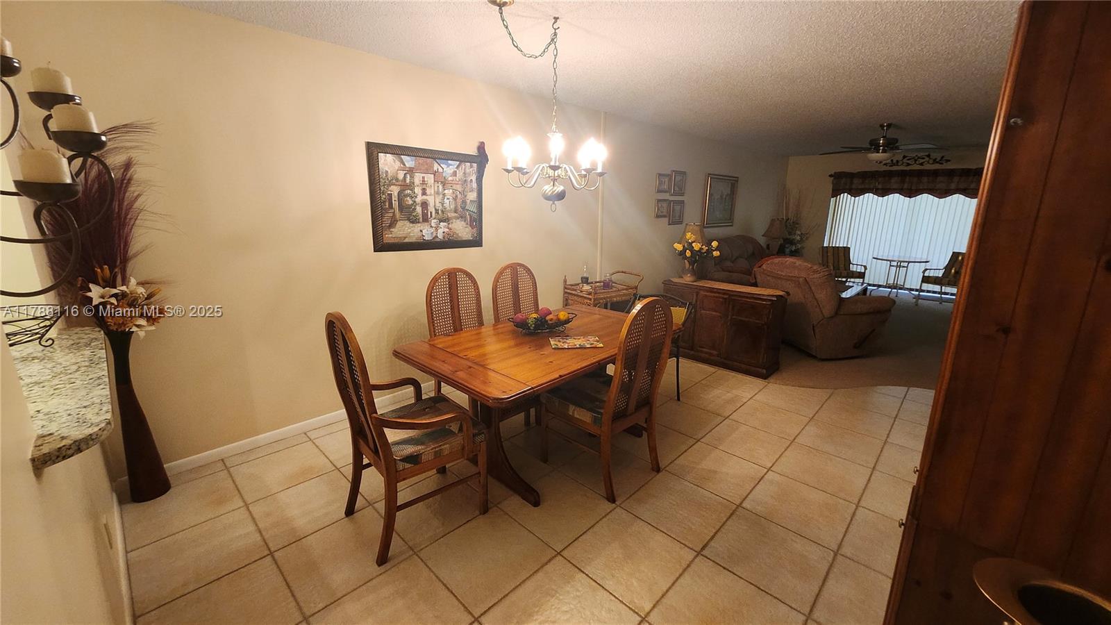 2955 Southwest 22nd Avenue, Unit 1040 Delray Beach, FL 33445 - Photo 13 of 27 a view of a dining room with furniture