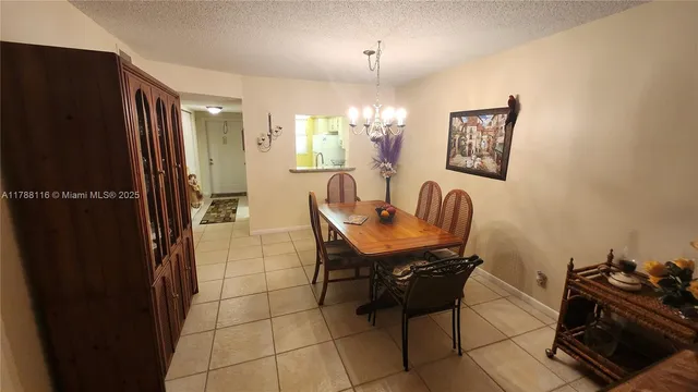a dining room with furniture and a window