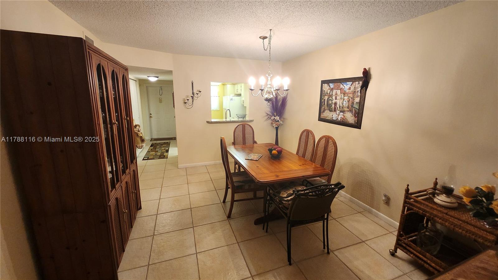 2955 Southwest 22nd Avenue, Unit 1040 Delray Beach, FL 33445 - Photo 14 of 27 a dining room with furniture and a window