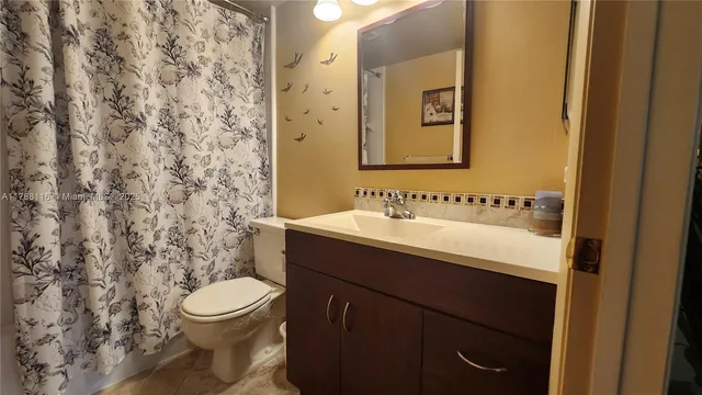 a bathroom with a sink and a toilet