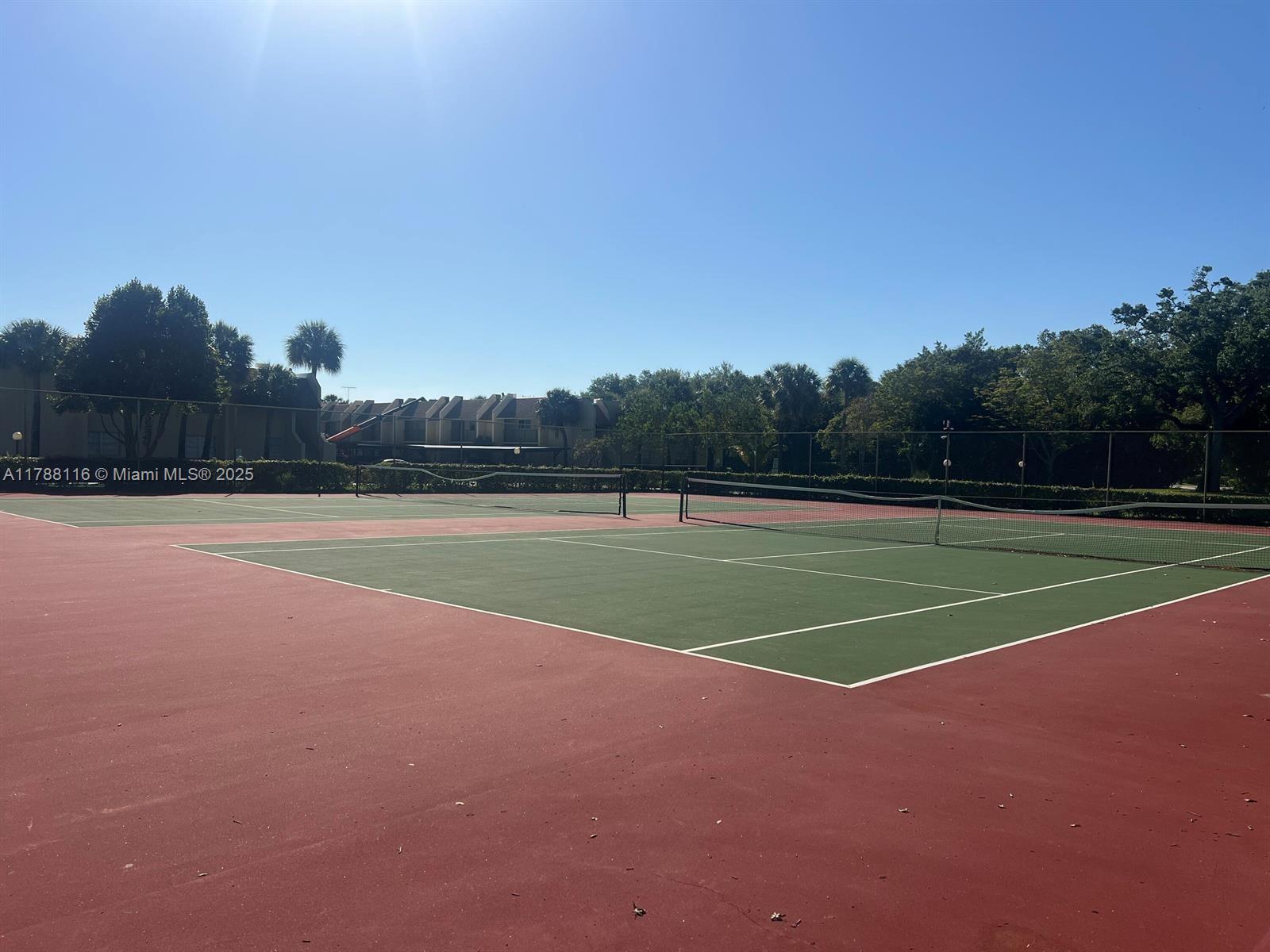 2955 Southwest 22nd Avenue, Unit 1040 Delray Beach, FL 33445 - Photo 25 of 27 a view of a tennis court