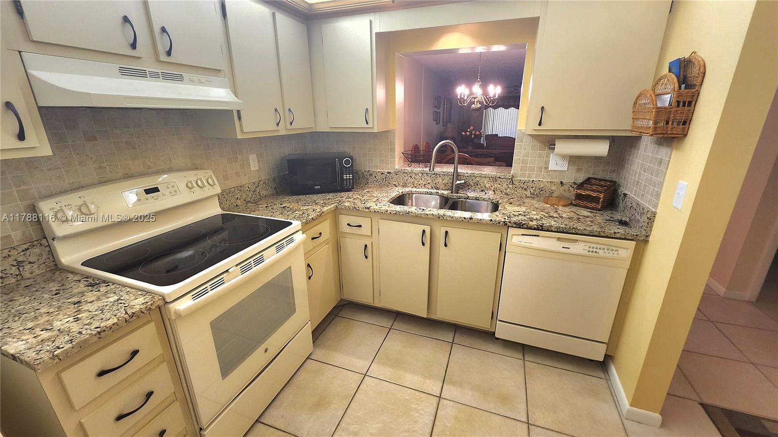 2955 Southwest 22nd Avenue, Unit 1040 Delray Beach, FL 33445 - Photo 9 of 27 a utility room with sink washer and dryer