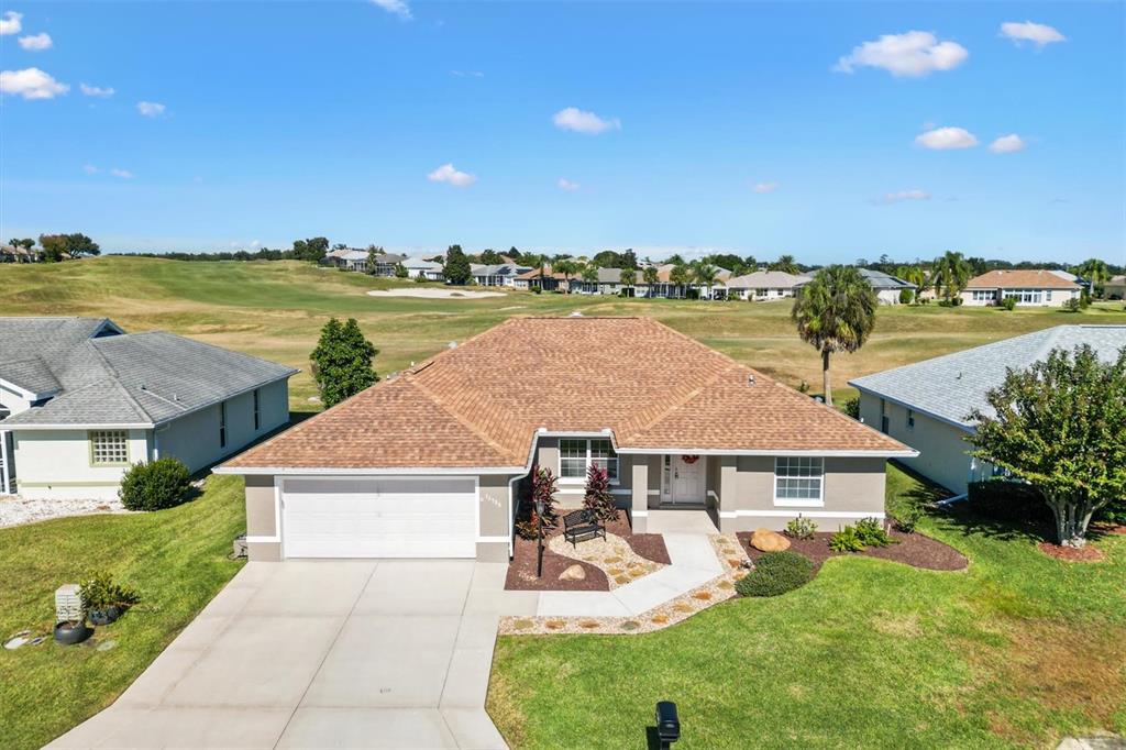 11735 Southeast 174th Loop Summerfield, FL 34491 - Photo 1 of 61 an aerial view of a house with big yard and large trees