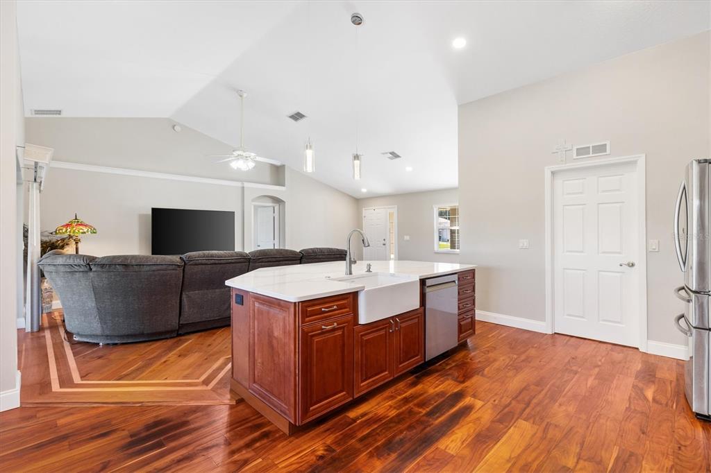 11735 Southeast 174th Loop Summerfield, FL 34491 - Photo 13 of 61 a kitchen with stainless steel appliances a stove and a living room