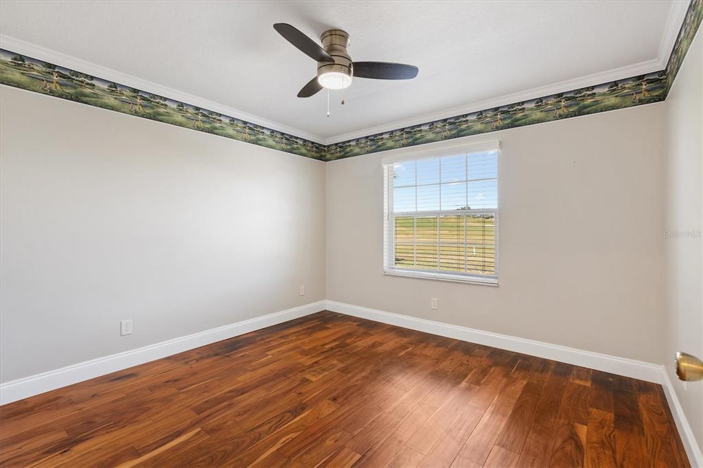 11735 Southeast 174th Loop Summerfield, FL 34491 - Photo 24 of 61 a view of an empty room with a window and a ceiling fan