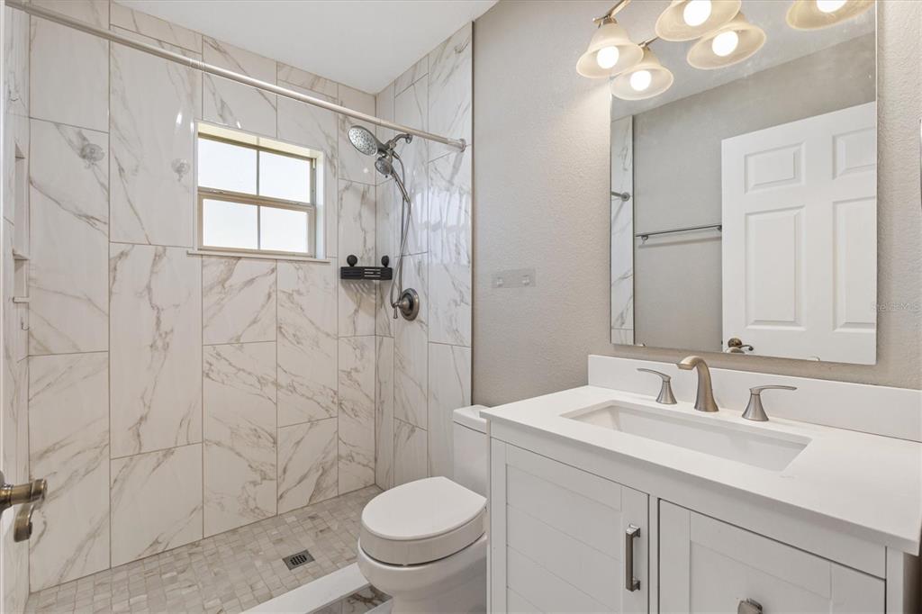 11735 Southeast 174th Loop Summerfield, FL 34491 - Photo 25 of 61 a bathroom with a sink toilet and shower