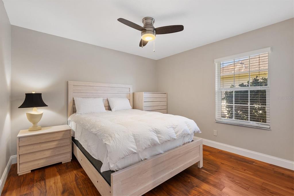 11735 Southeast 174th Loop Summerfield, FL 34491 - Photo 27 of 61 a bedroom with a bed and wooden floor