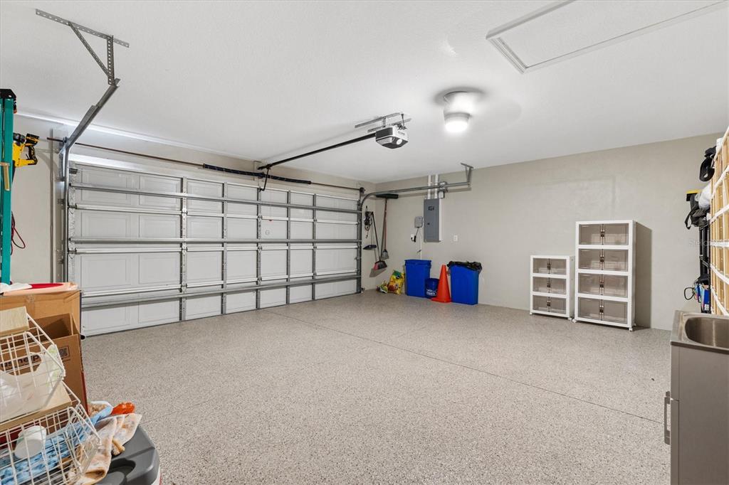 11735 Southeast 174th Loop Summerfield, FL 34491 - Photo 35 of 61 a view of a garage with furniture and storage