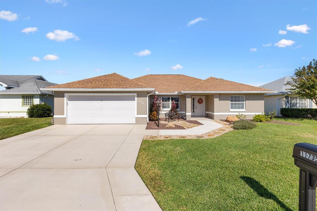 11735 Southeast 174th Loop Summerfield, FL 34491 - Photo 37 of 61 a front view of a house with yard and green space