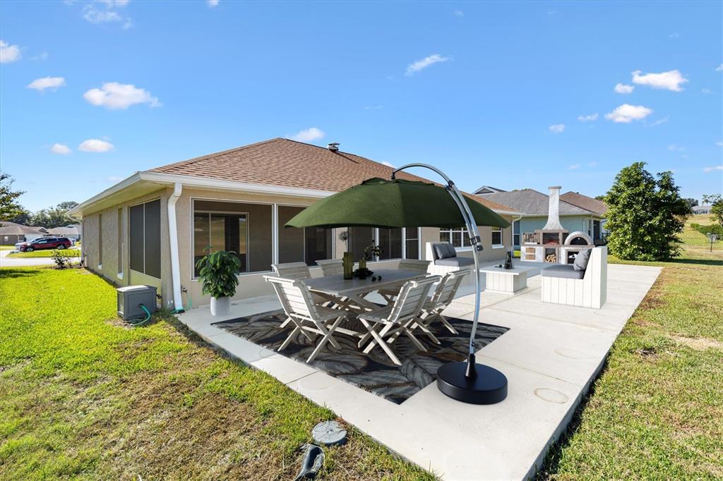 11735 Southeast 174th Loop Summerfield, FL 34491 - Photo 39 of 61 a view of a patio with chairs and tables