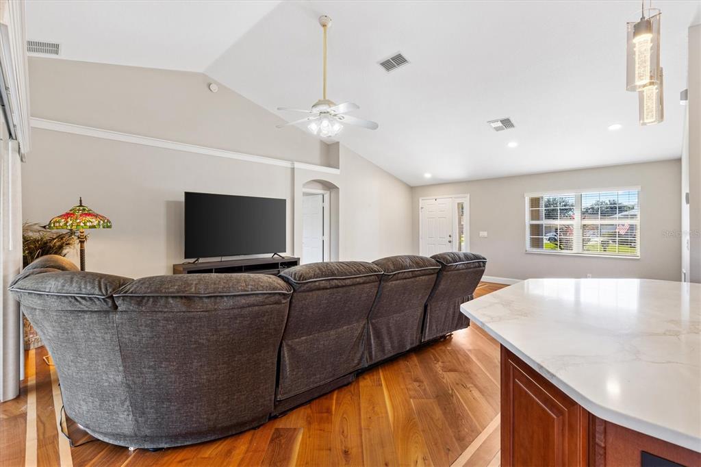 11735 Southeast 174th Loop Summerfield, FL 34491 - Photo 7 of 61 a living room with furniture and a flat screen tv