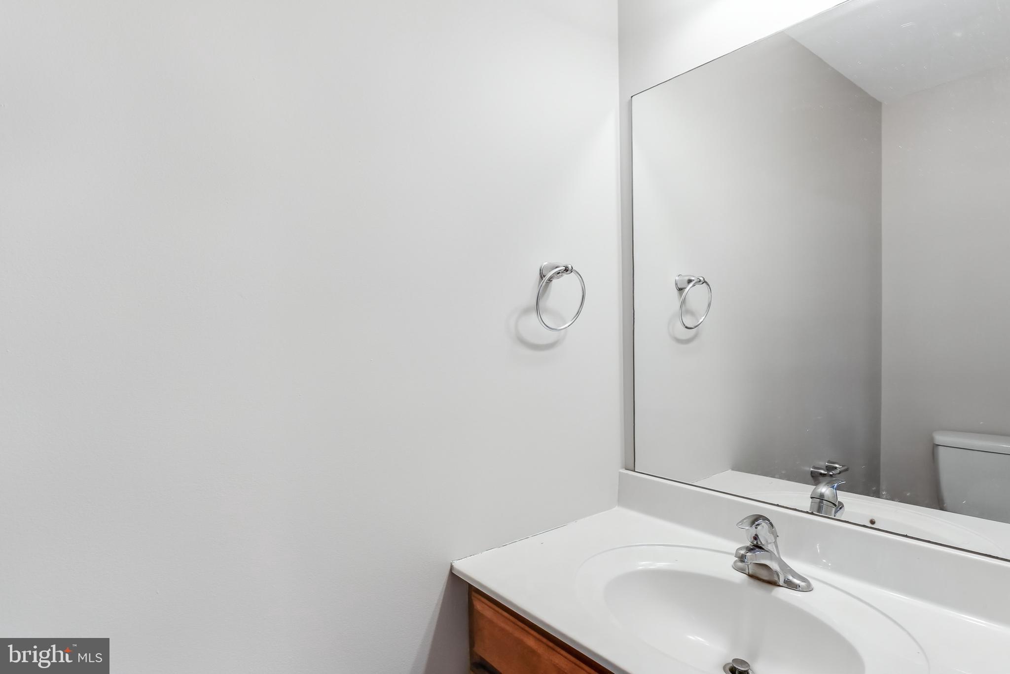 2500 Mill Road, Unit 7 Mechanicsburg, PA 17055 - Photo 5 of 11 a bathroom with a sink and a mirror
