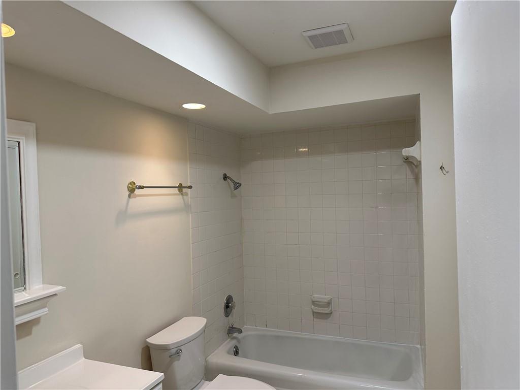 3071 Colonial Way, Unit K Atlanta, GA 30341 - Photo 13 of 20 a bathroom with a toilet and a bathtub