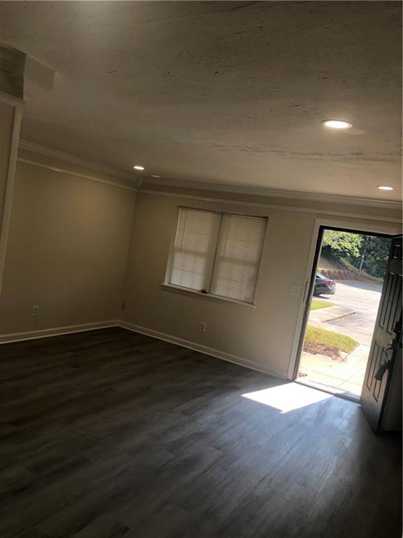 3071 Colonial Way, Unit K Atlanta, GA 30341 - Photo 3 of 20 an empty room with wooden floor and windows