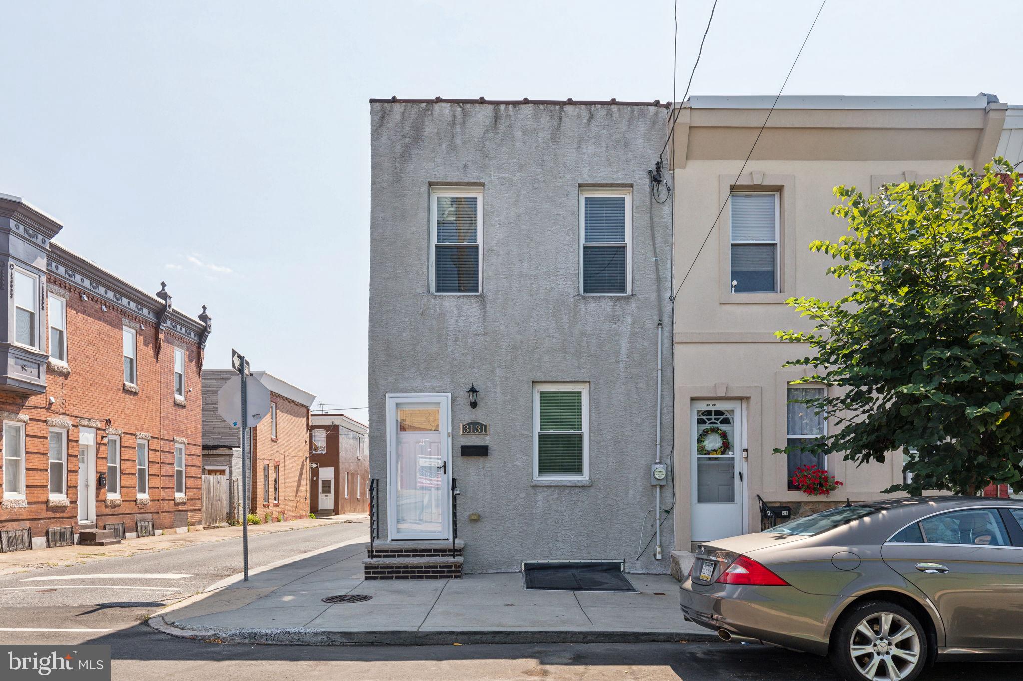a front view of a building with parking