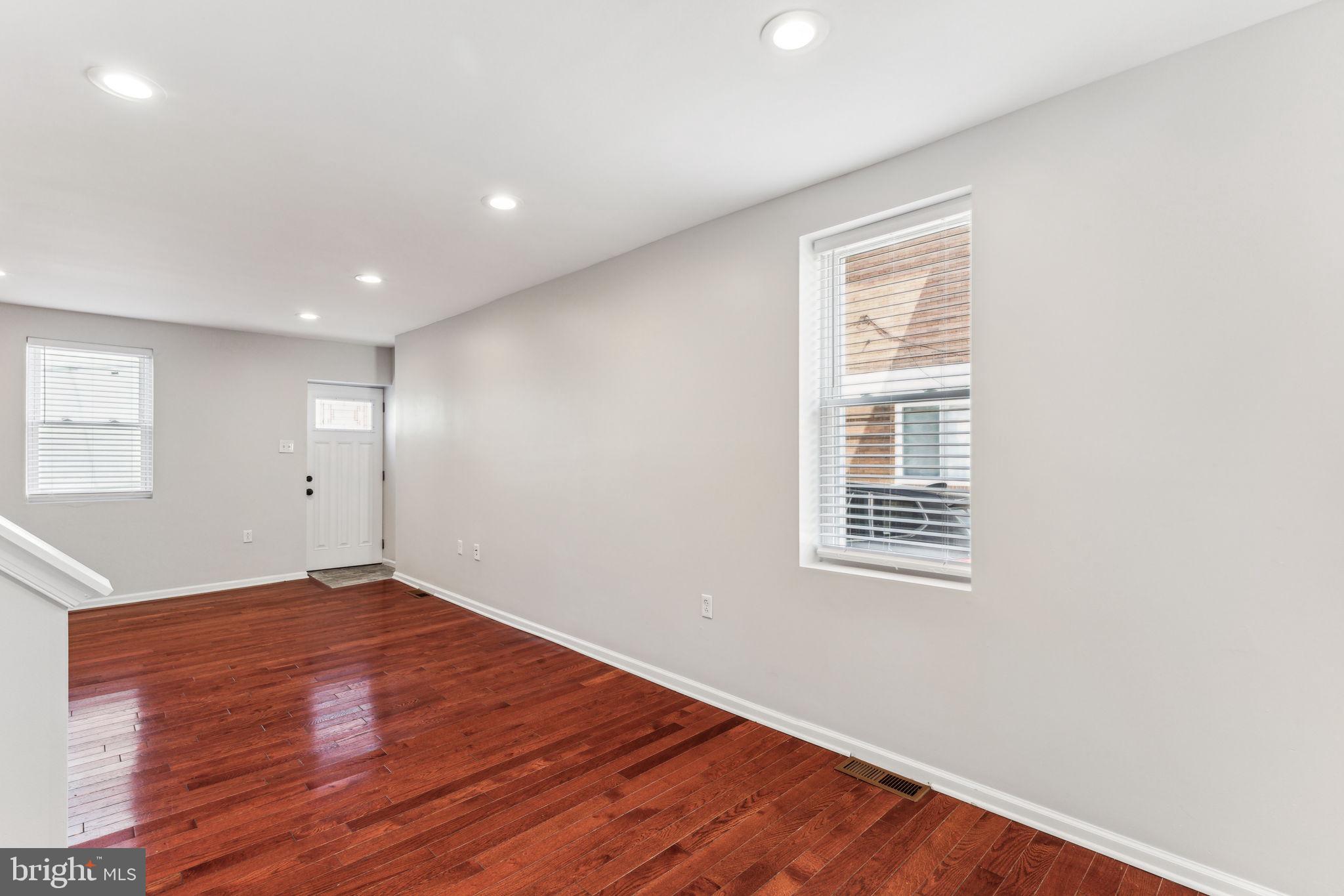 3131 Edgemont Street Philadelphia, PA 19134 - Photo 12 of 39 an empty room with wooden floor and windows