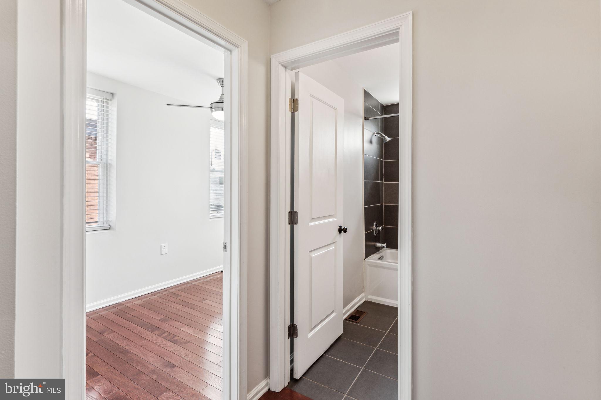 3131 Edgemont Street Philadelphia, PA 19134 - Photo 27 of 39 a view of a hallway with wooden floor and closet area