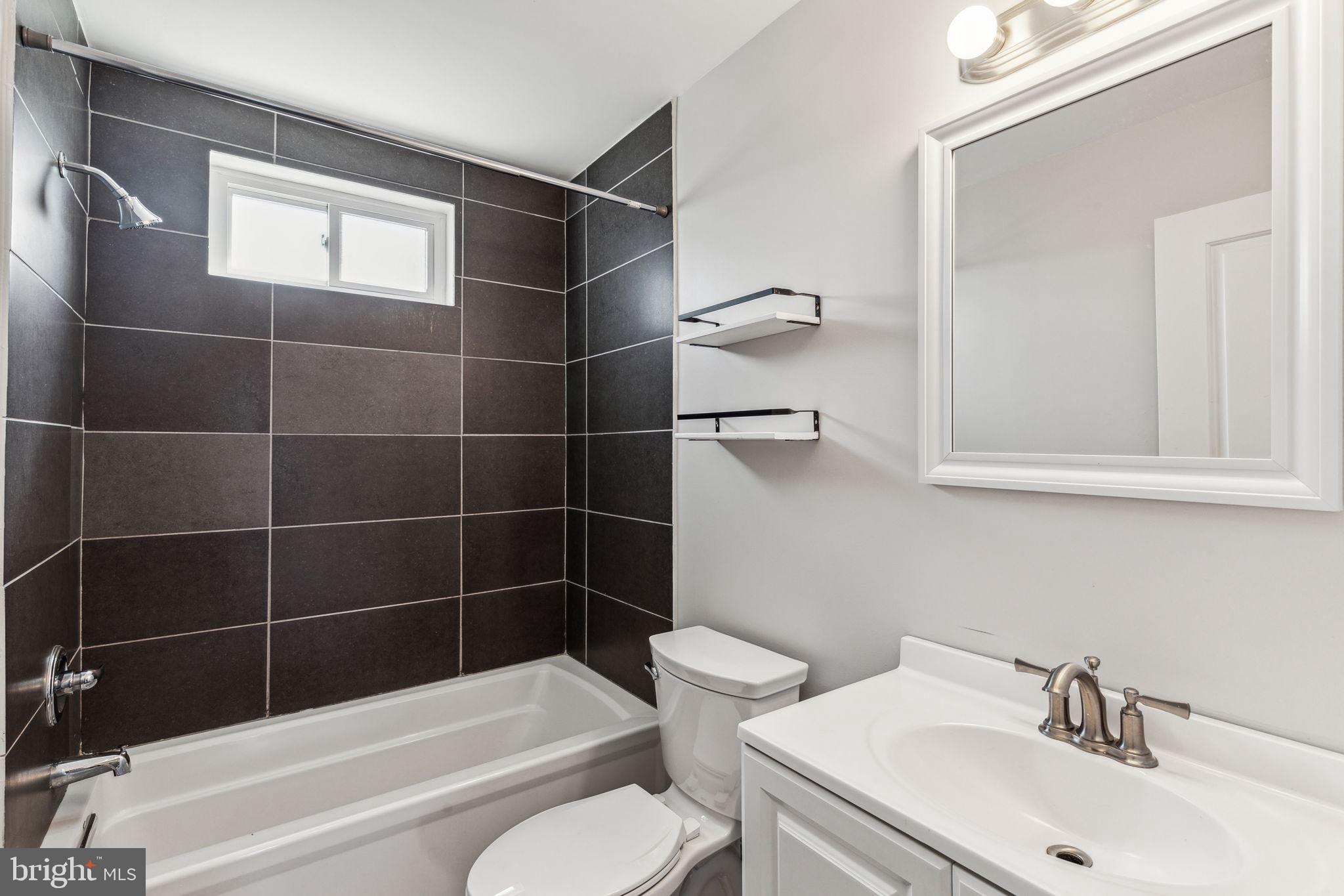 3131 Edgemont Street Philadelphia, PA 19134 - Photo 28 of 39 a bathroom with a sink toilet and shower