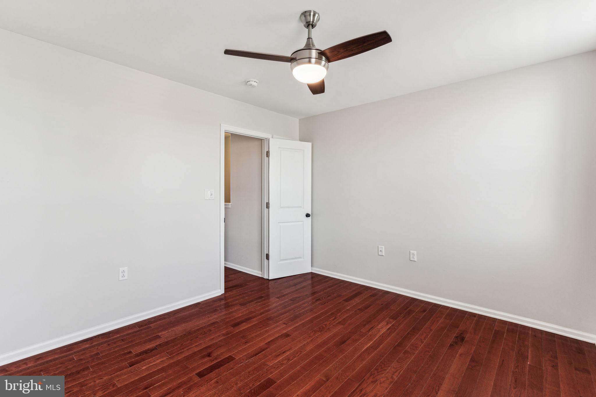 3131 Edgemont Street Philadelphia, PA 19134 - Photo 29 of 39 a view of a room with wooden floor and white walls