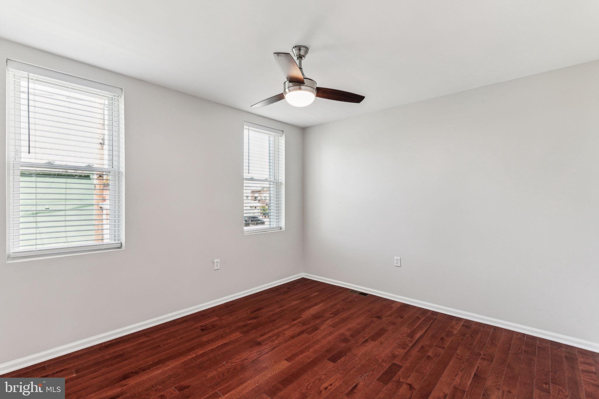 3131 Edgemont Street Philadelphia, PA 19134 - Photo 30 of 39 a view of empty room with wooden floor and fan
