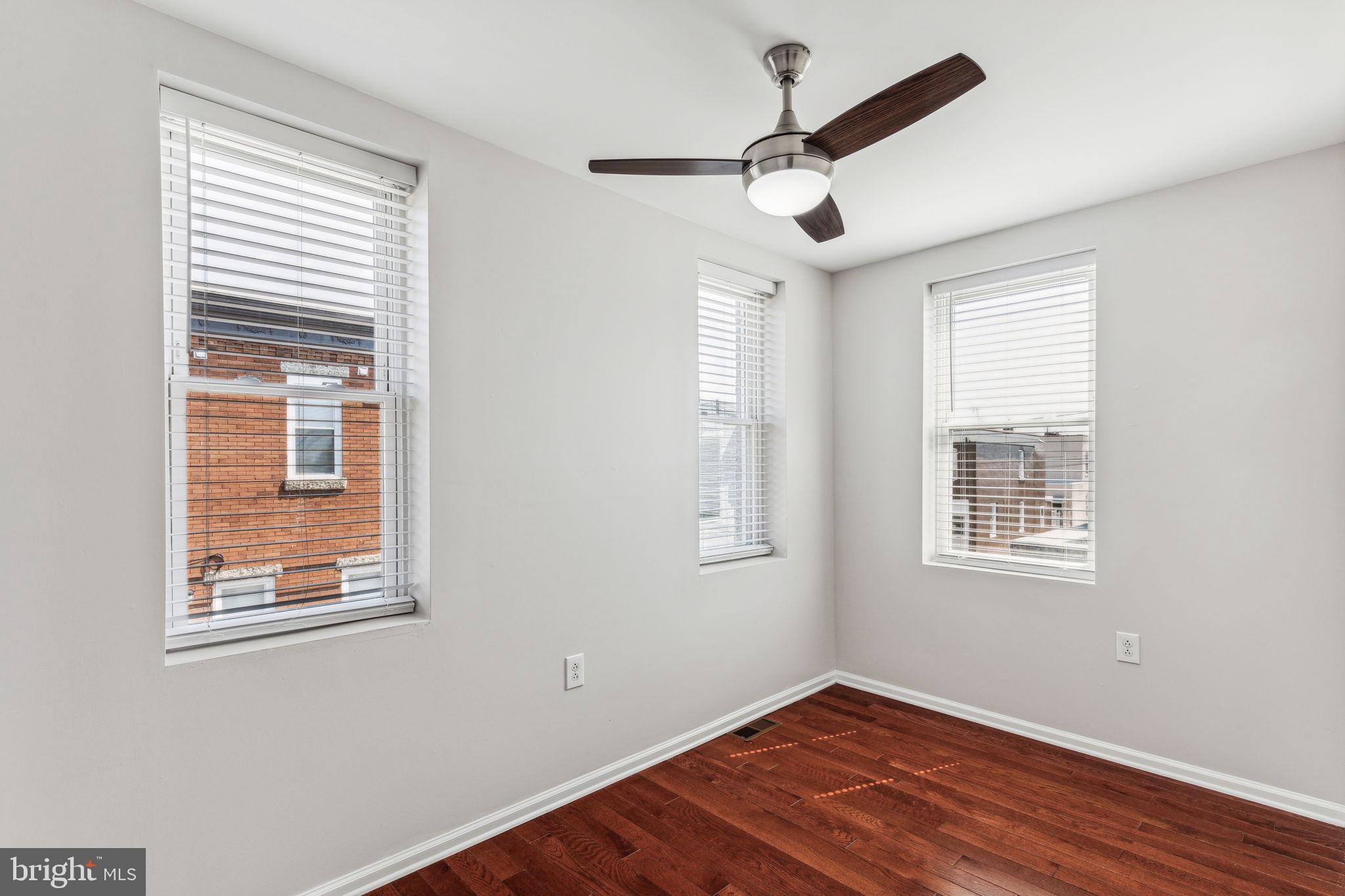 3131 Edgemont Street Philadelphia, PA 19134 - Photo 33 of 39 a view of an empty room with wooden floor and a window