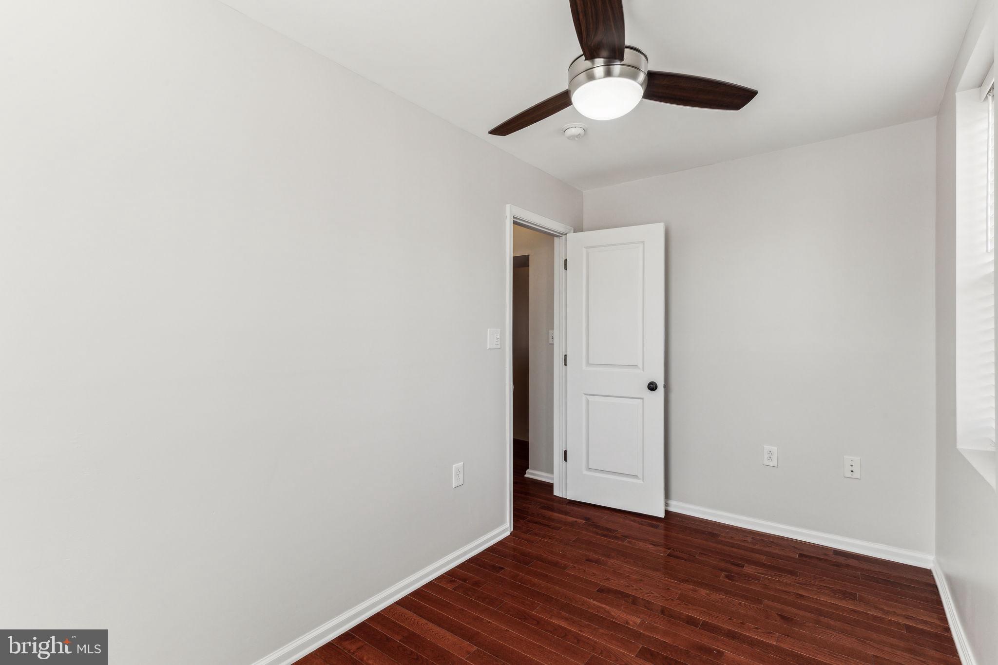 3131 Edgemont Street Philadelphia, PA 19134 - Photo 34 of 39 a view of an empty room with wooden floor