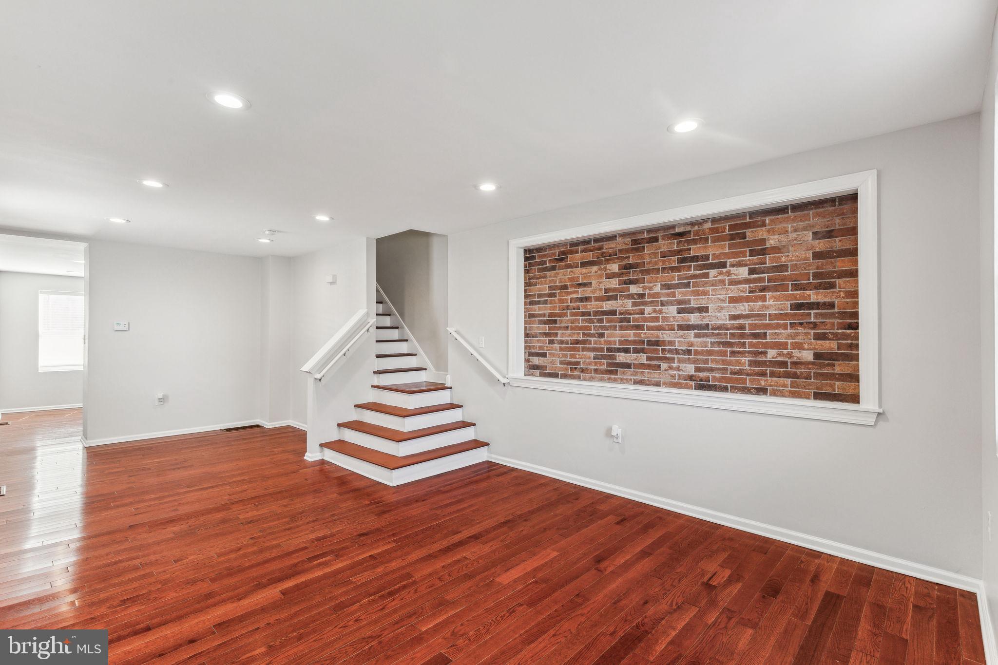 3131 Edgemont Street Philadelphia, PA 19134 - Photo 8 of 39 a view of an empty room with wooden floor and a window