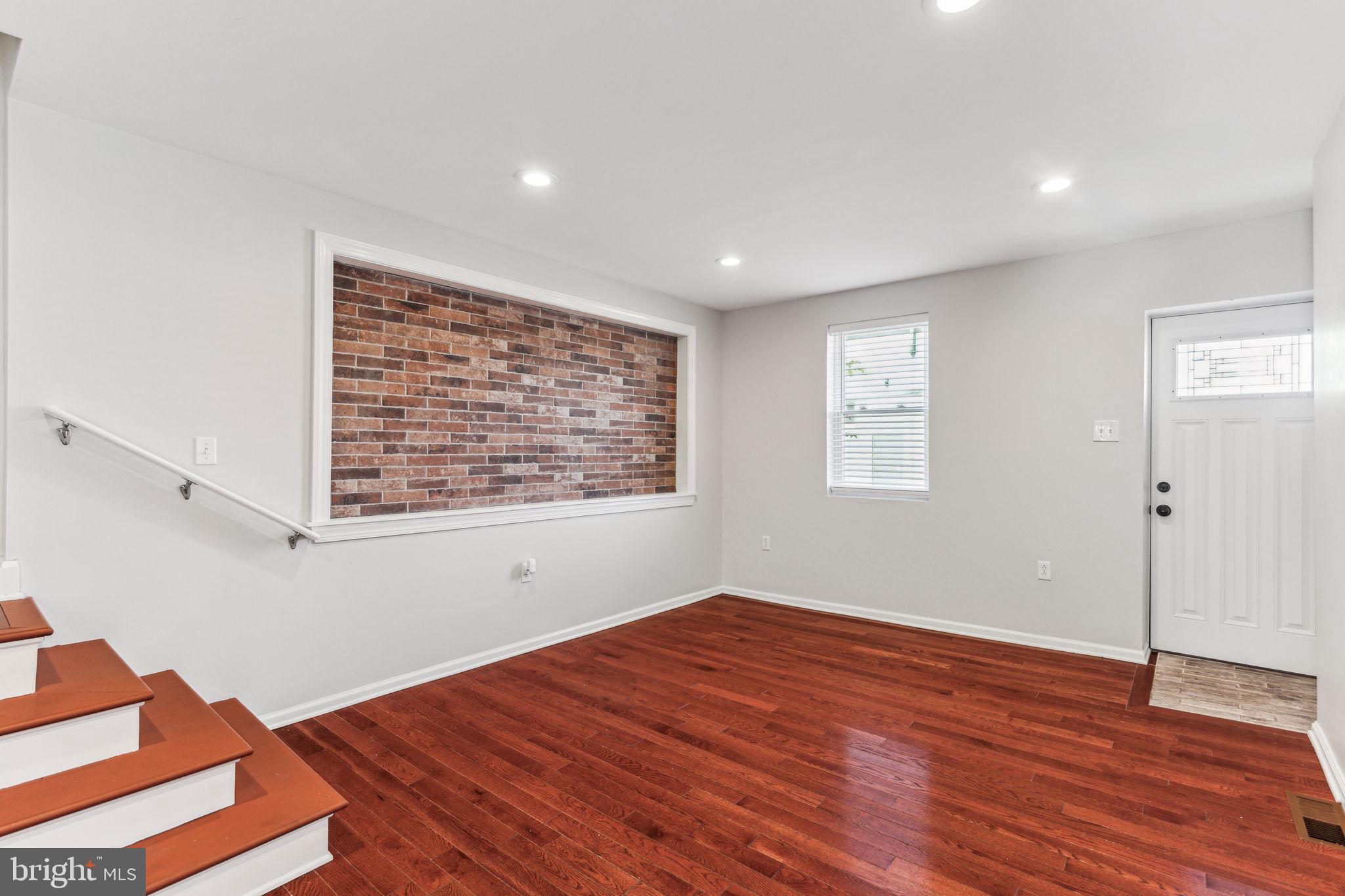 3131 Edgemont Street Philadelphia, PA 19134 - Photo 9 of 39 a view of an empty room with wooden floor and a window