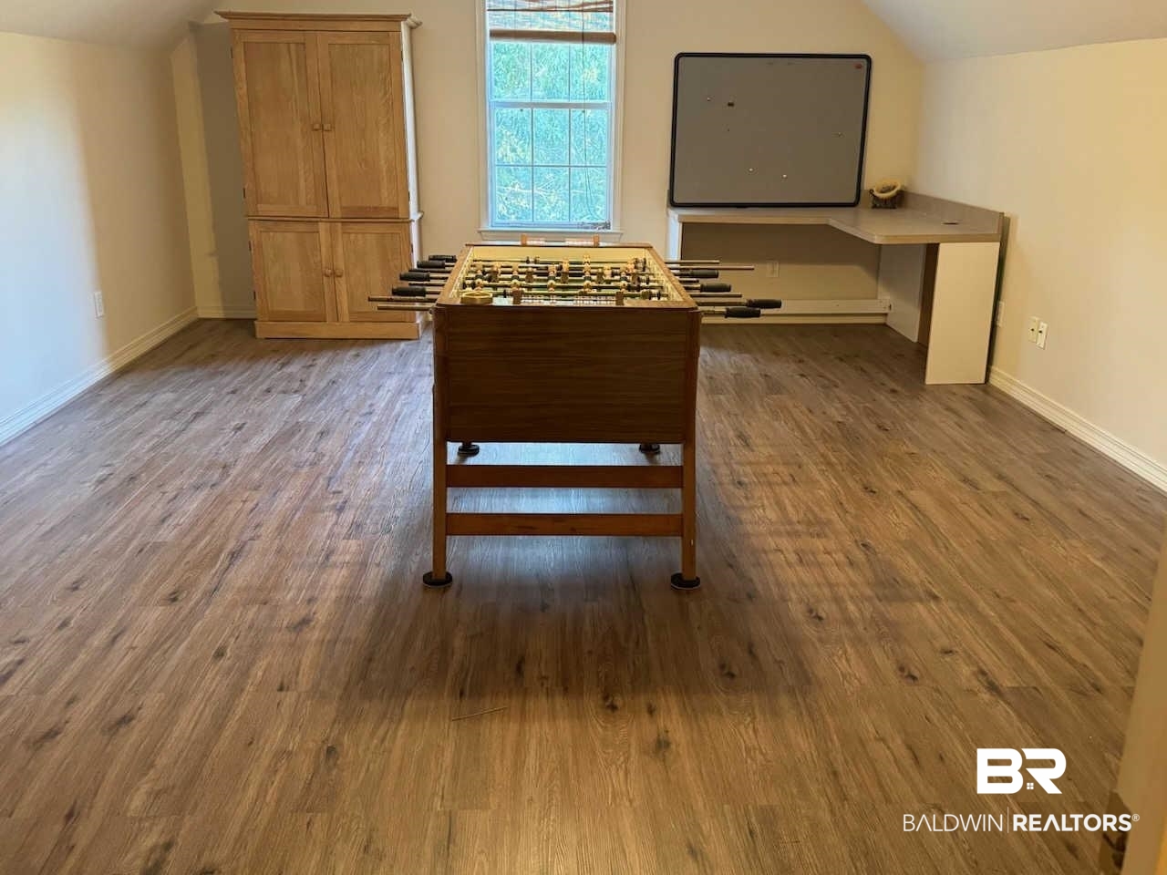 31163 Woodland Way Daphne, AL 36527 - Photo 34 of 44 Interior space featuring hardwood / wood-style floors and vaulted ceiling
