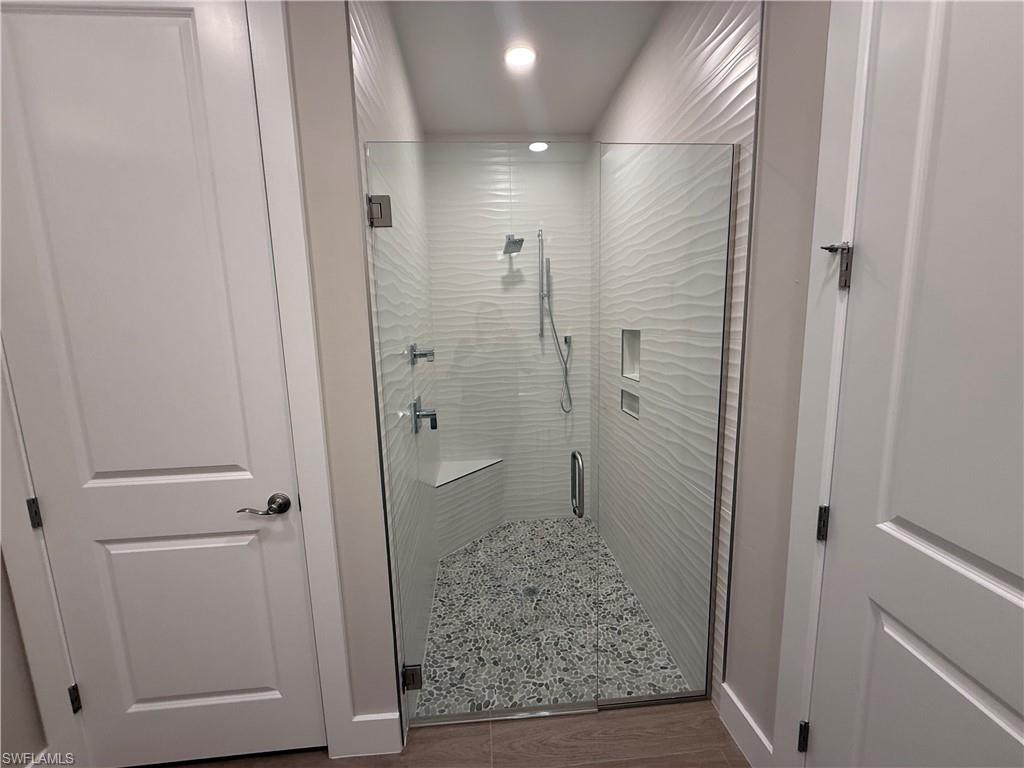8909 Oceana Way Naples, FL 34114 - Photo 16 of 41 a bathroom with a shower and toilet