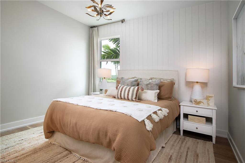 8909 Oceana Way Naples, FL 34114 - Photo 7 of 41 a bedroom with a bed and a window