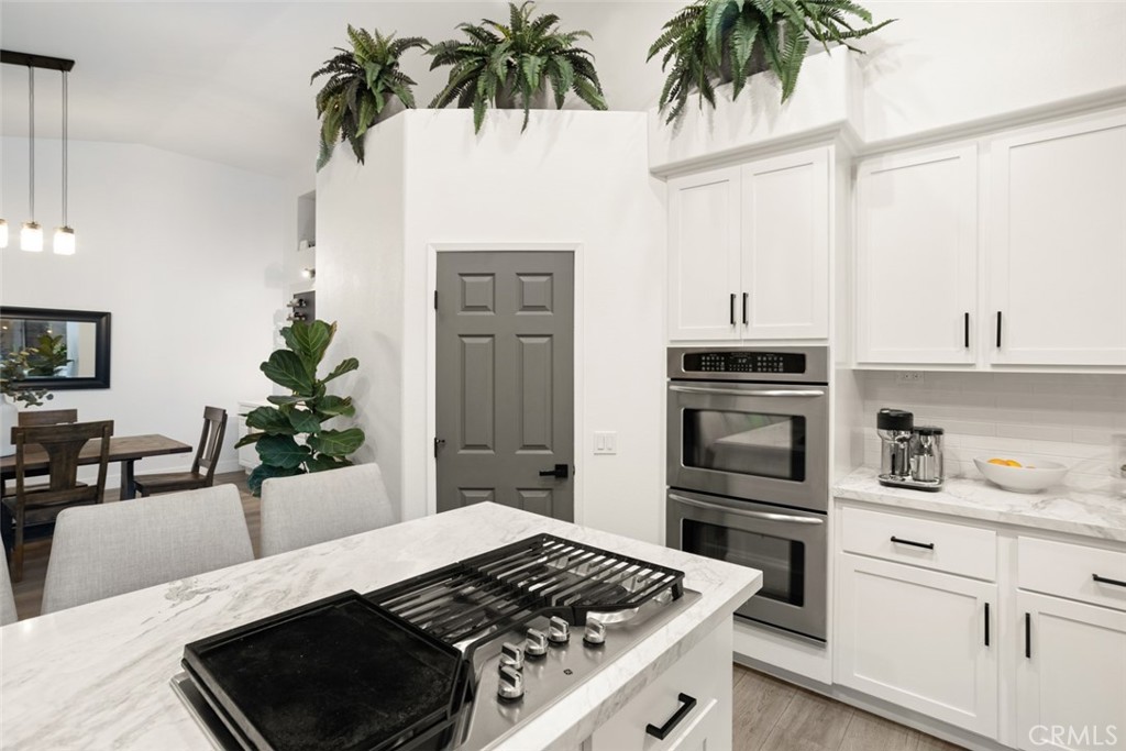 2531 Cottage Drive Corona, CA 92881 - Photo 15 of 48 a kitchen with a refrigerator and a stove