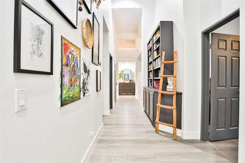 2531 Cottage Drive Corona, CA 92881 - Photo 19 of 48 a view of a hallway with wooden floor and windows