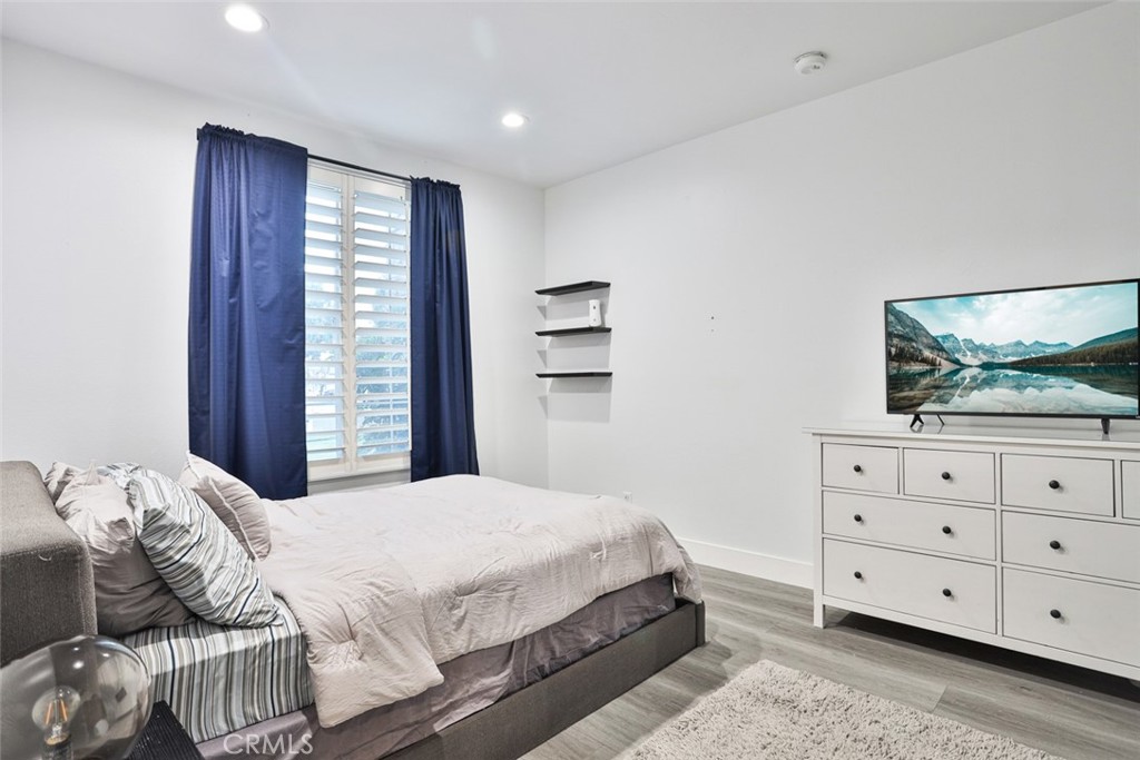 2531 Cottage Drive Corona, CA 92881 - Photo 31 of 48 a bedroom with a bed and a dresser
