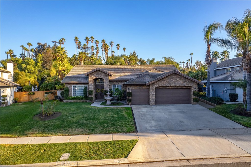 2531 Cottage Drive Corona, CA 92881 - Photo 48 of 48 a front view of a house with a yard and garage