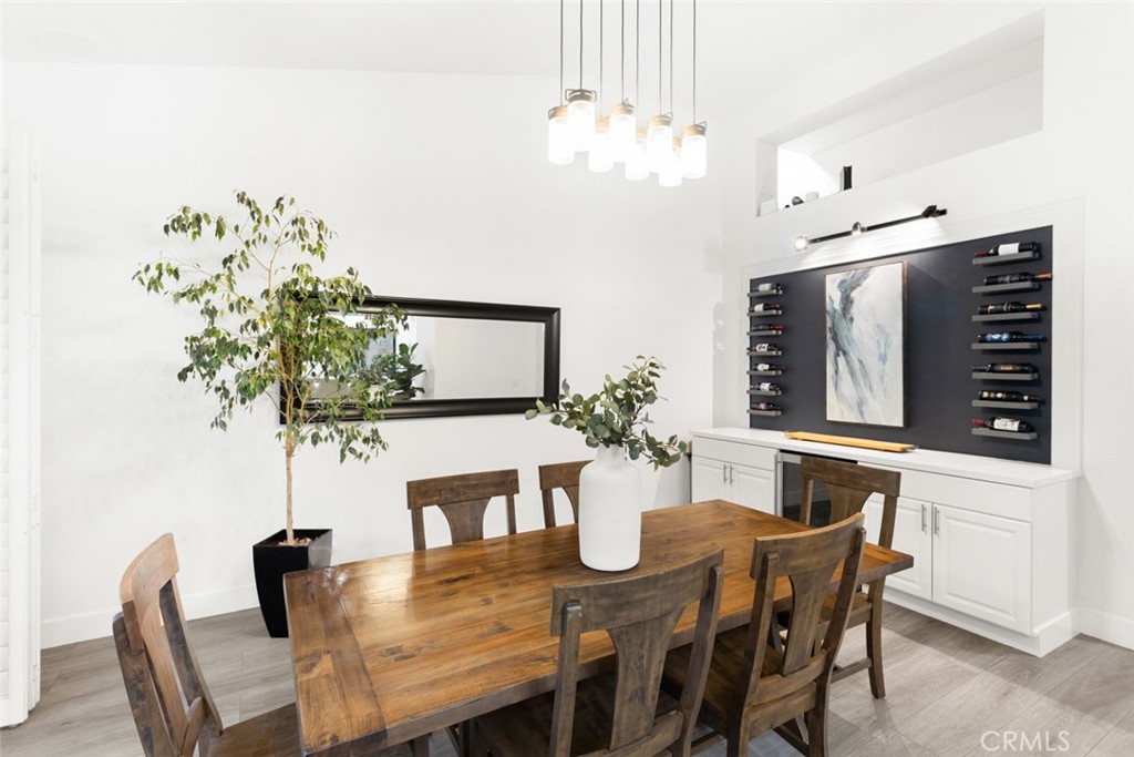 2531 Cottage Drive Corona, CA 92881 - Photo 6 of 48 a dining room with furniture potted plants and wooden floor