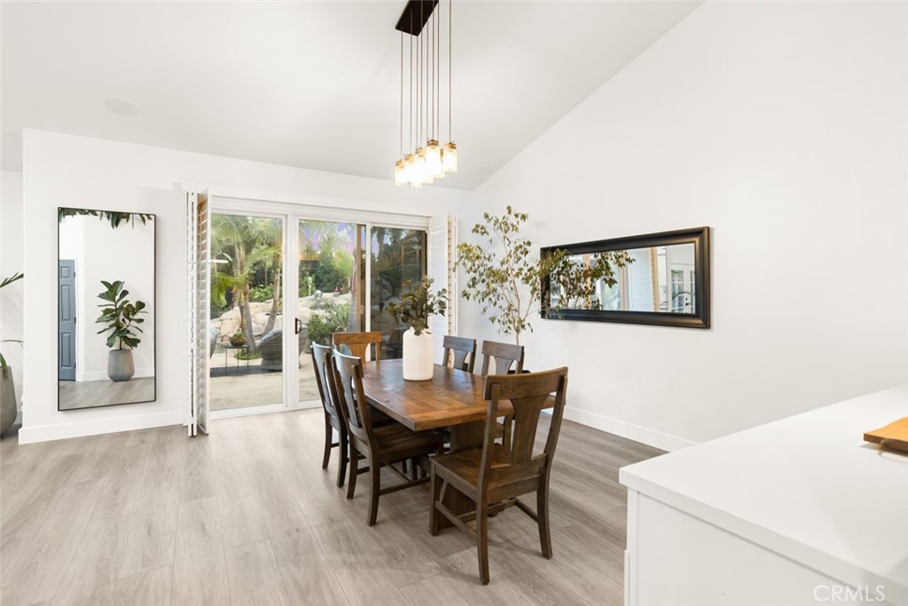 2531 Cottage Drive Corona, CA 92881 - Photo 7 of 48 a view of a dining room with furniture wooden floor and chandelier