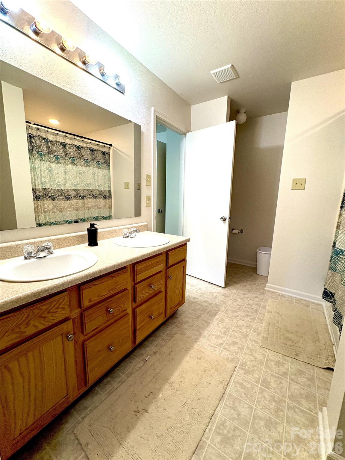 2514 Spring Breeze Way Monroe, NC 28110 - Photo 16 of 25 a bathroom with a double vanity sink mirror and double