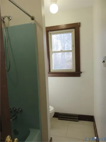 a bathroom with a tub and shower