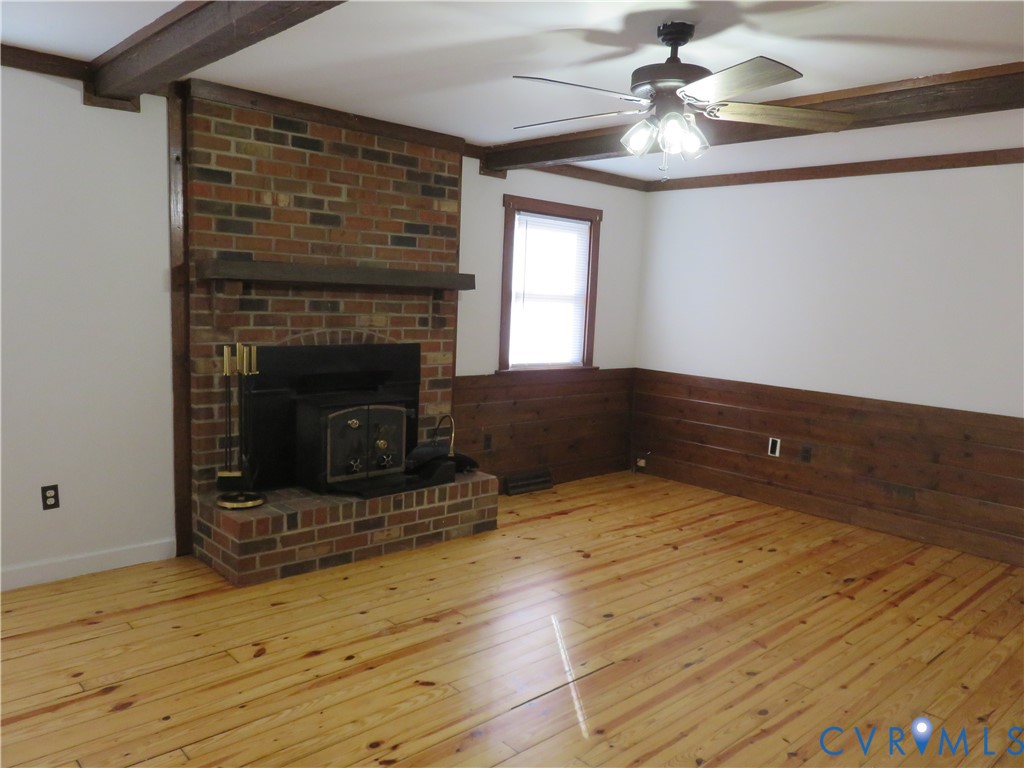 4261 Old Buckingham Road Powhatan, VA 23139 - Photo 10 of 23 a living room with furniture and a fireplace