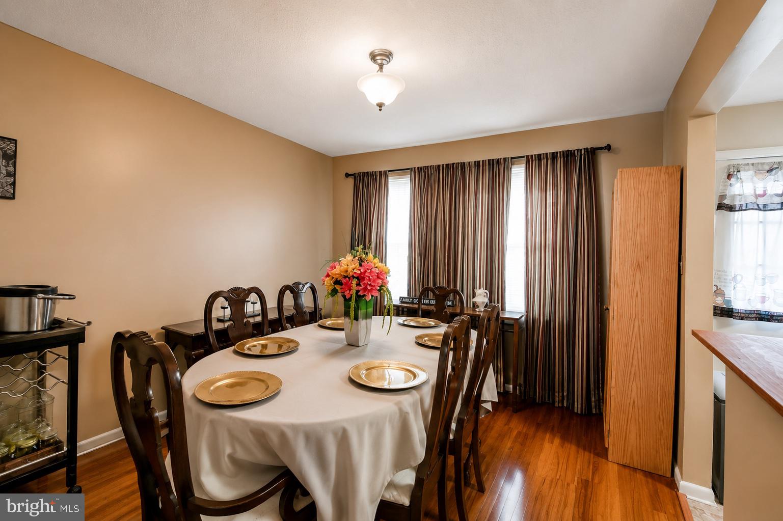 8121 Elizabeth Road Pasadena, MD 21122 - Photo 8 of 27 a view of a dining room with furniture window and wooden floor