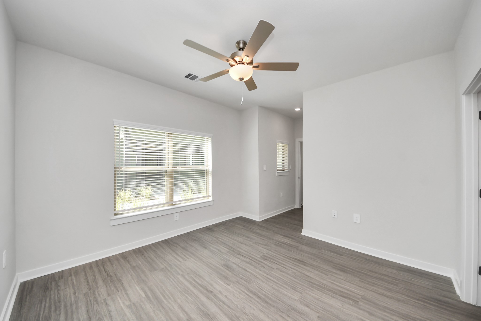 7711 Longmire Road, Unit 5 Conroe, TX 77304 - Photo 13 of 48 Primary Suite offers walk-closet,bath w/dual vanities&lux tub/shower.