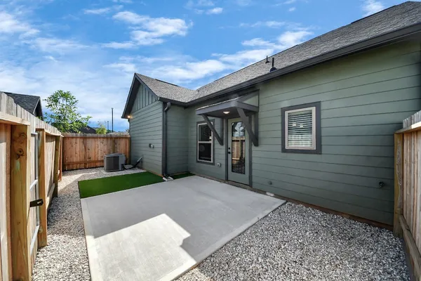 a view of house with swimming pool outdoor seating and green space