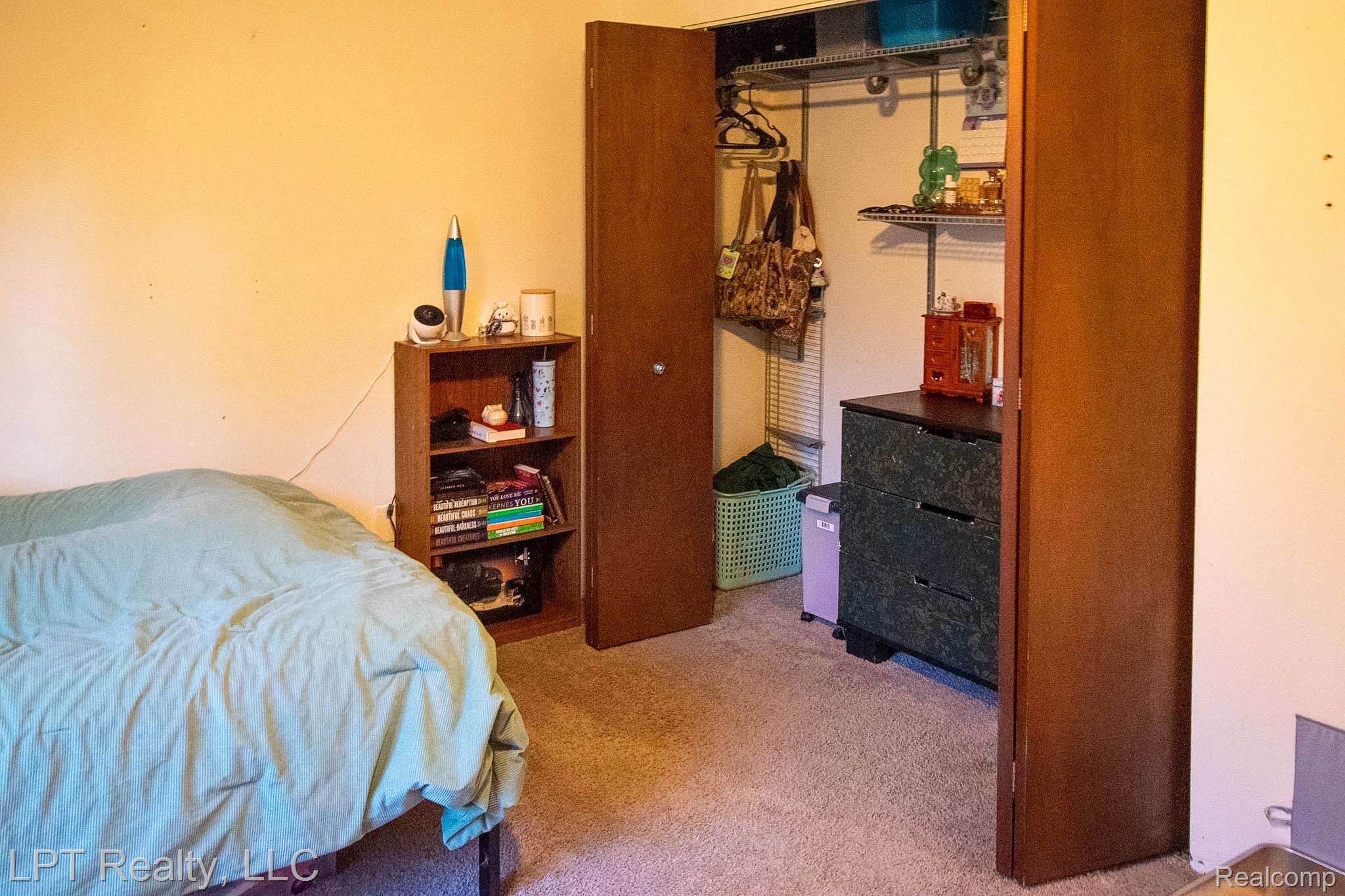 217 Nawakwa Road Rochester, MI 48307 - Photo 18 of 29 Bedroom featuring light colored carpet and a closet